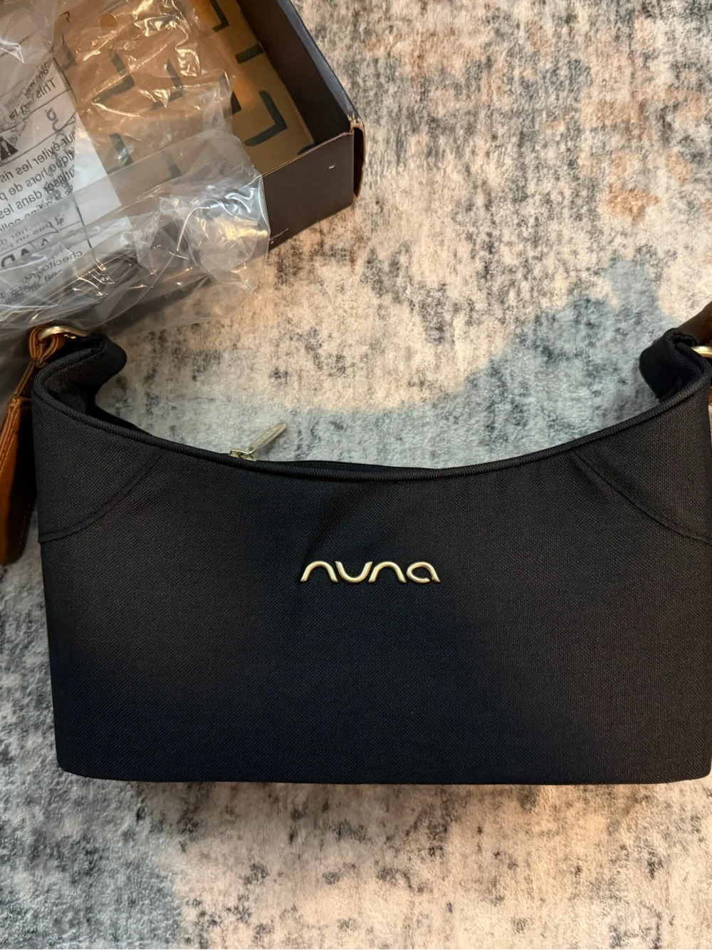 Black NUNA stroller organizer